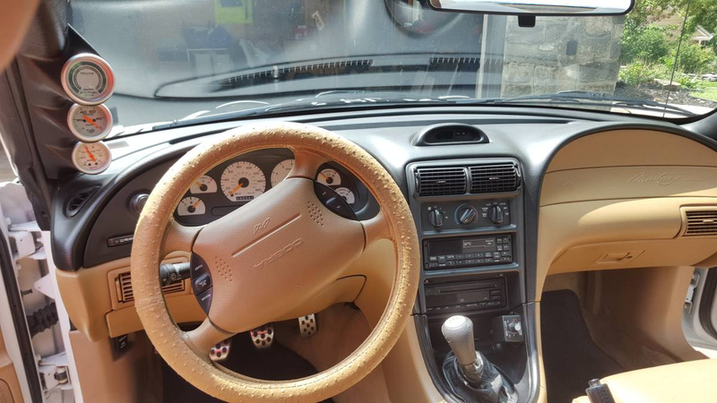 Illustration for article titled At $13,250, Would Buying This 1997 Ford Mustang Cobra Mean That You Can Tell Shit From Shinoda?